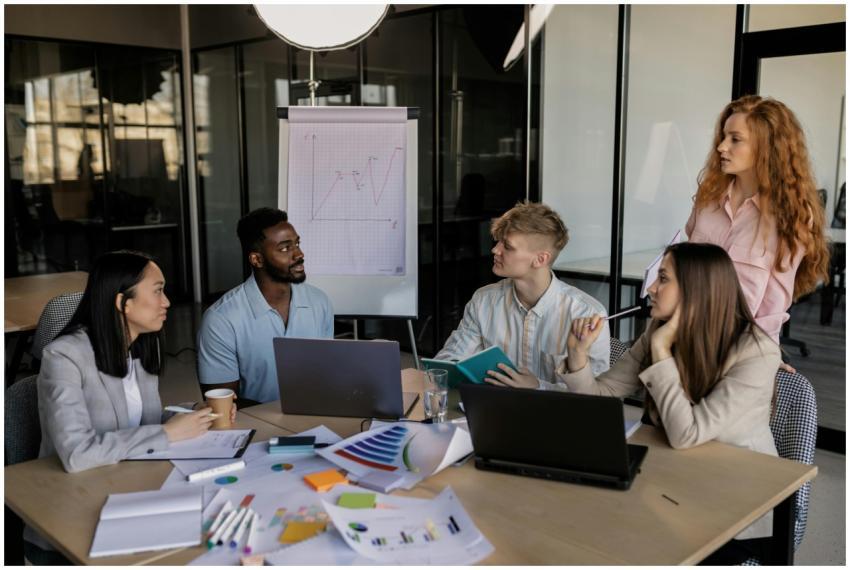 A diverse team discussing business strategy around