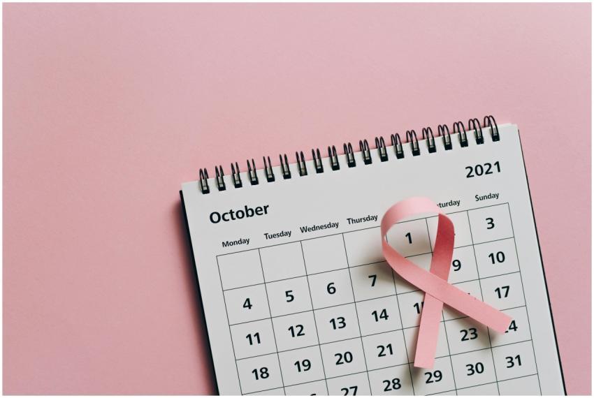 Pink ribbon on October calendar symbolizes breast