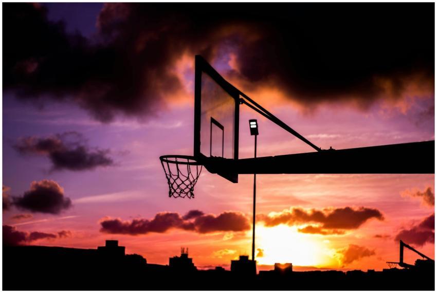 Stunning silhouette of a basketball hoop against a