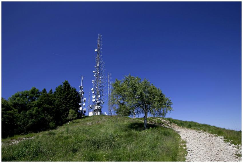 A landscape featuring broadcast towers on a grassy