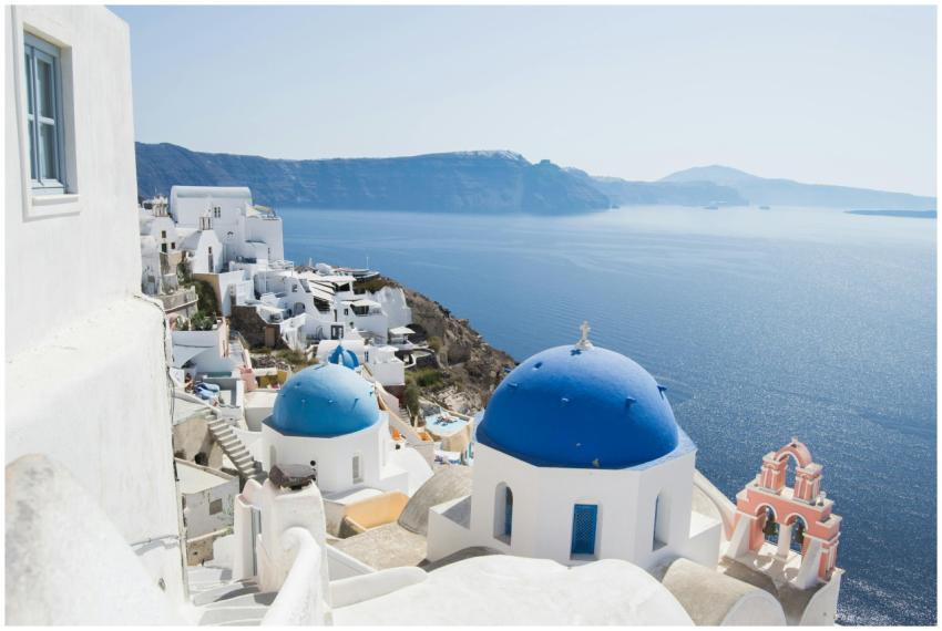 Iconic Santorini view with blue domed churches and