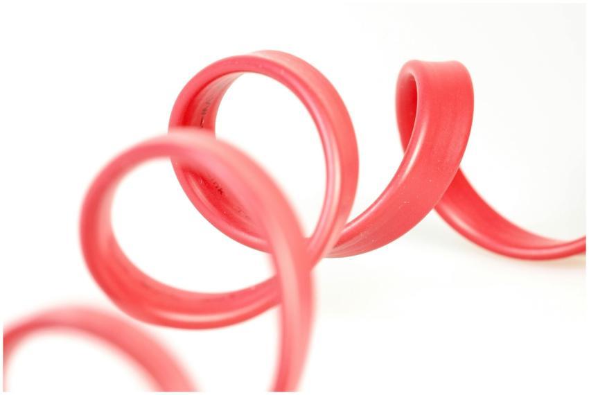 Close-up of a red rubber tube with elegant curves