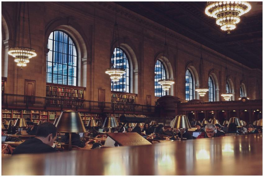 Interior view of a bustling reading room with chan
