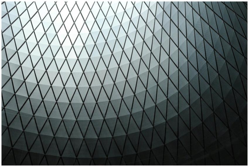 Abstract view of a geometric dome ceiling with a d