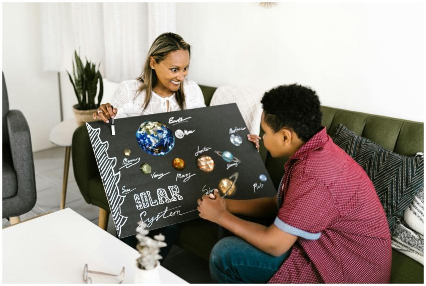 Mother and child learning about the solar system w
