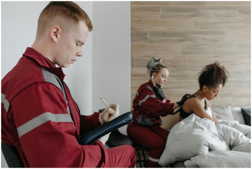 Paramedics providing medical care to a patient at