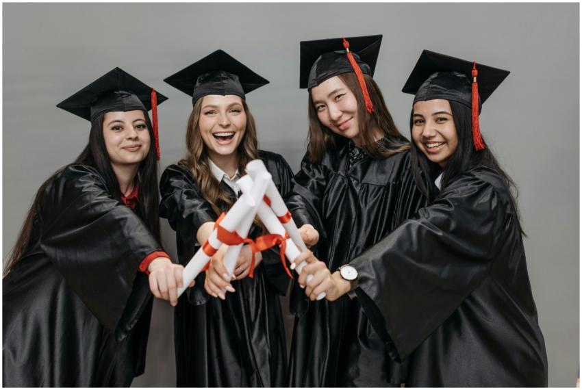 A joyful group of multiracial women in graduation