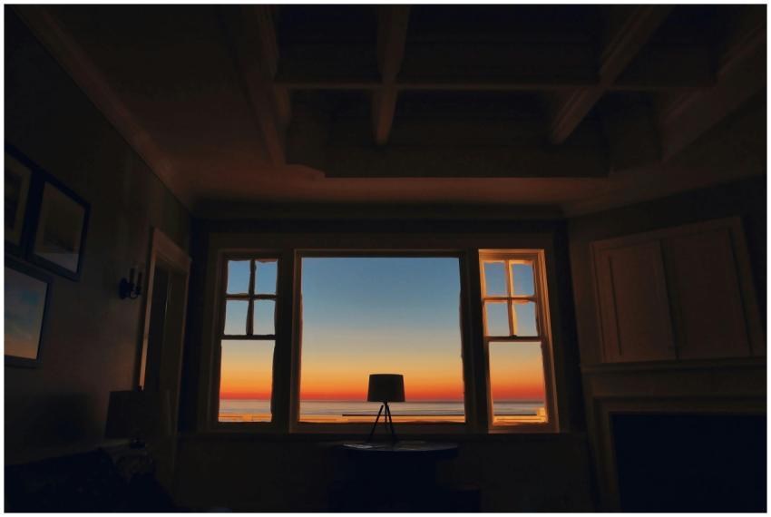 Dark silhouette of a room with a stunning sunset v