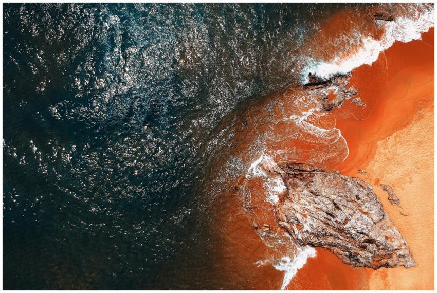 A stunning aerial shot of a vibrant seashore with