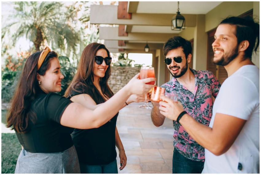 A cheerful group of friends enjoying a summer part