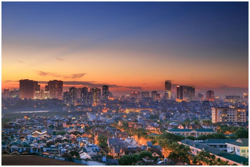 City skyline at twilight with vibrant colors, show