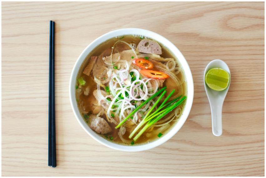 Authentic Vietnamese pho with fresh herbs and spic