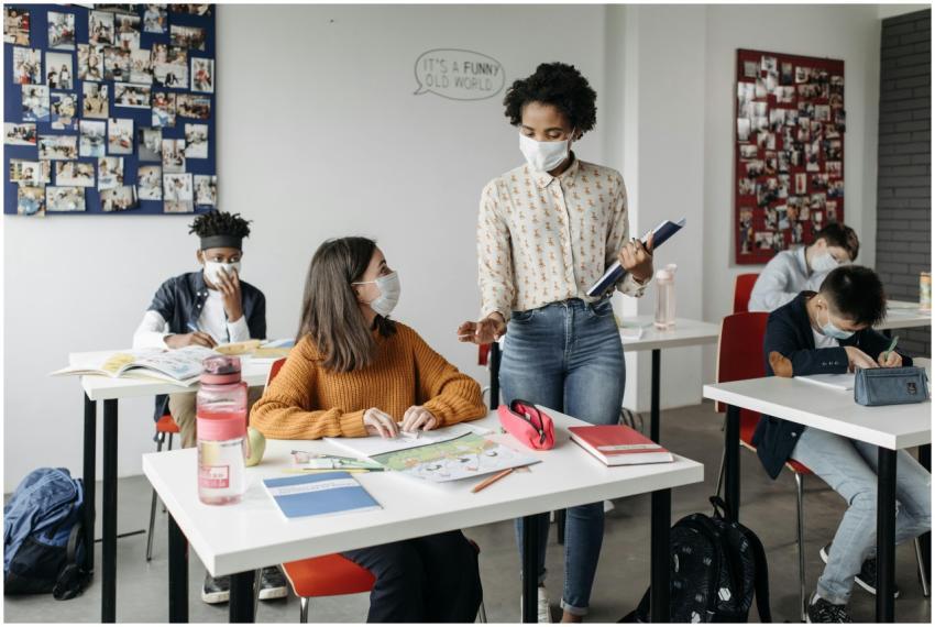 Students and teacher engaged in a classroom settin