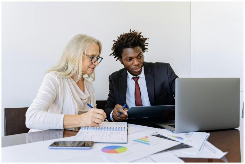 Two business professionals collaborating at a desk