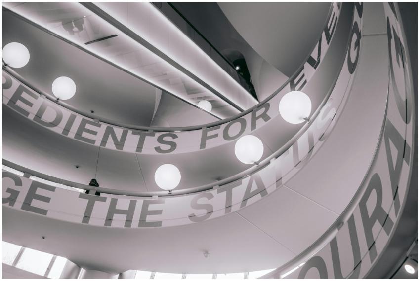 A low-angle view of a modern spiral staircase with