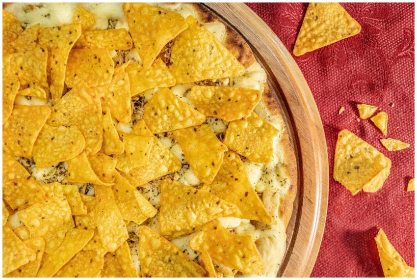 A top-down view of a cheesy pizza generously toppe