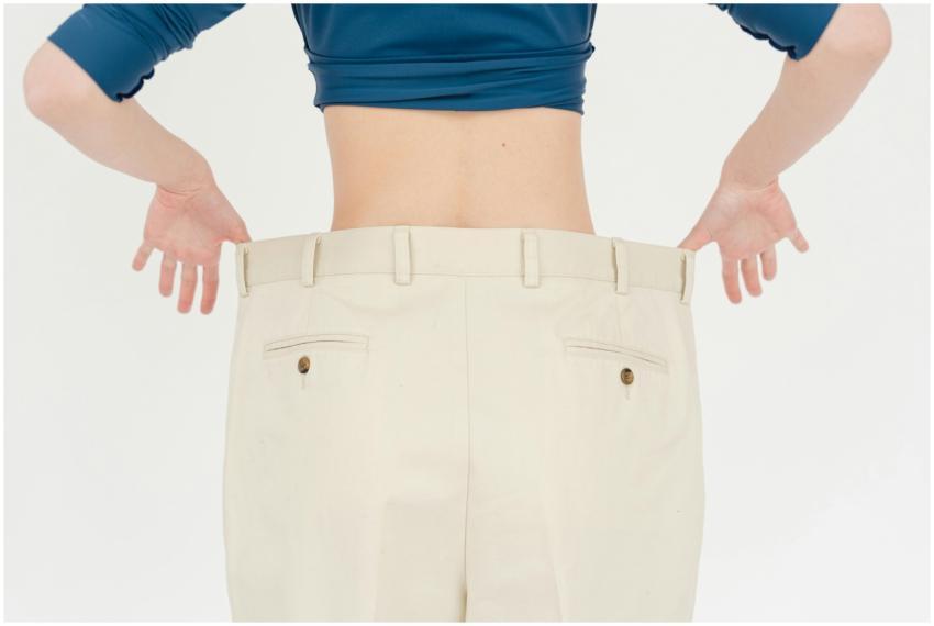 A woman's back view showcasing weight loss with ov