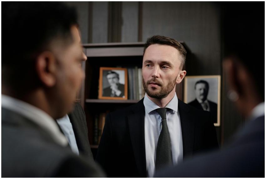 Group of men in suits having a serious business di