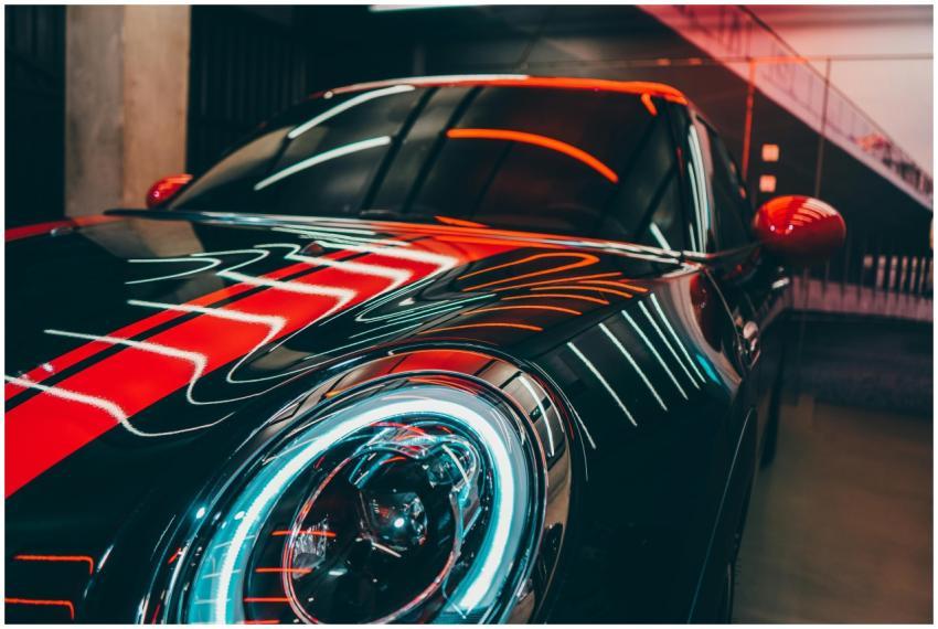 A luxury sports car in a modern setting with vibra