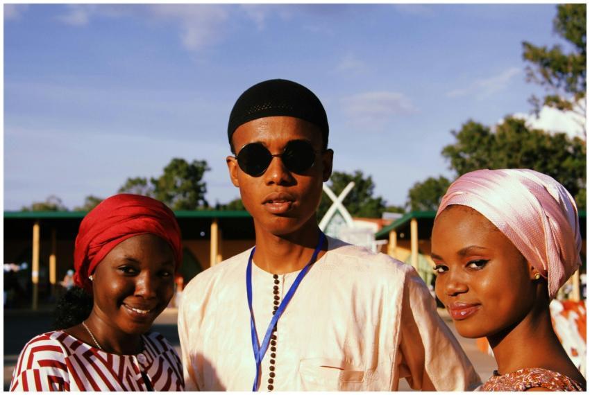 Group of friends smiling outdoors in traditional a