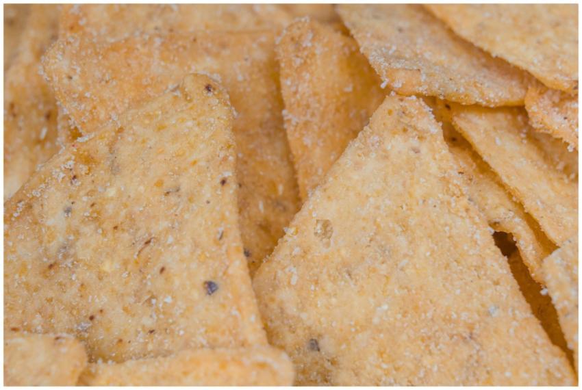 A macro view of crunchy, salted corn chips, perfec