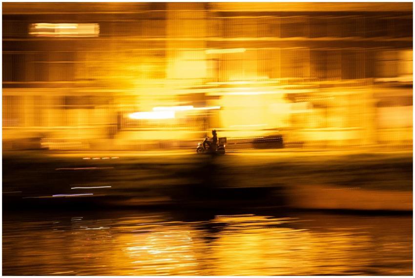 Dynamic long exposure capture of a scooter at nigh