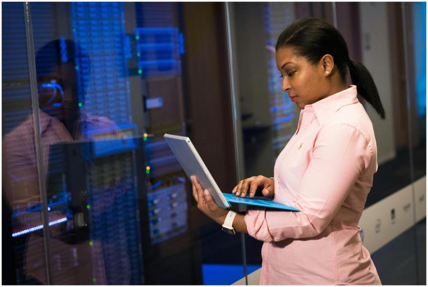 A focused software engineer working on a laptop in