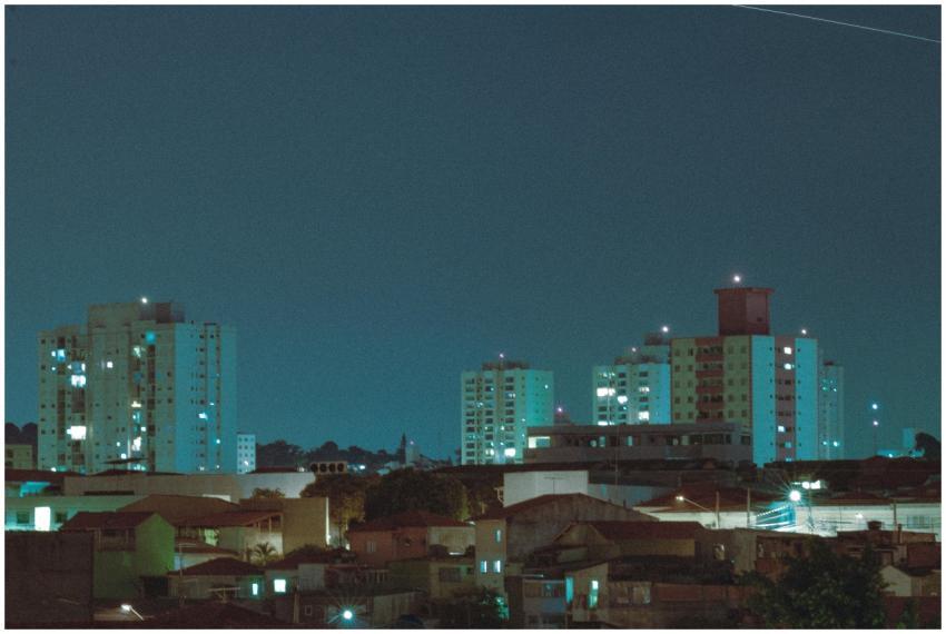 A tranquil cityscape at night showcasing high-rise