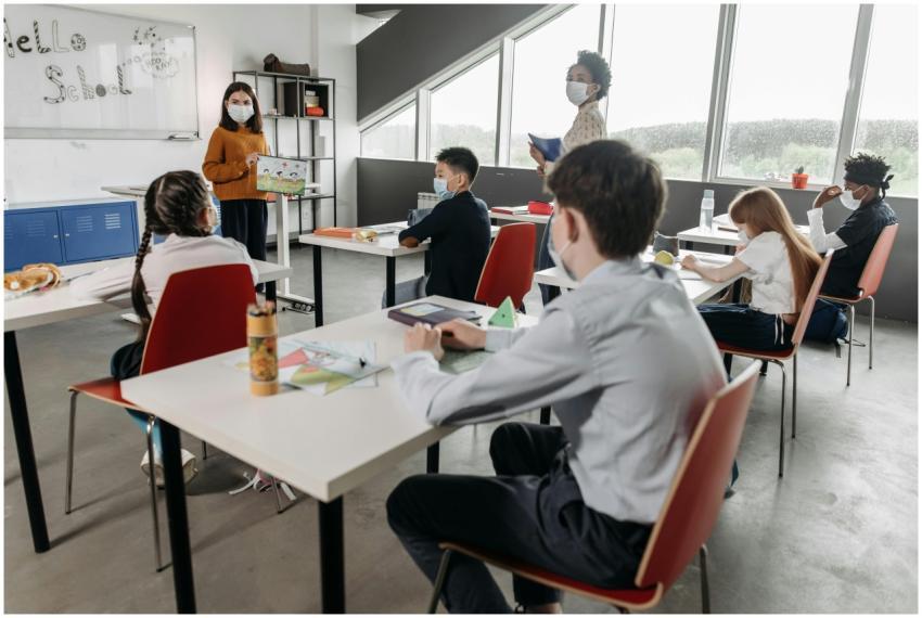 Children wearing face masks during a classroom les