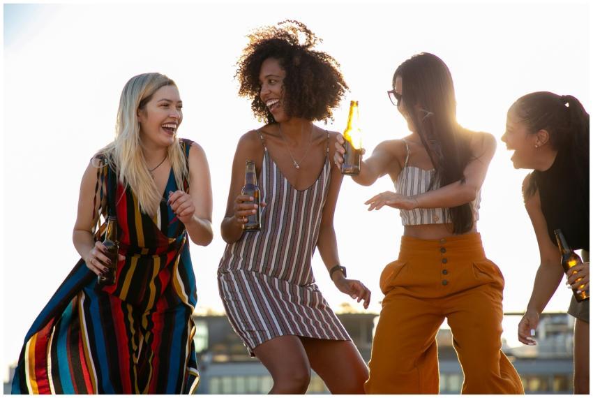 Group of cheerful young multiracial ladies laughin