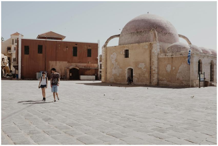 Tourists walking near historic architecture in Cha