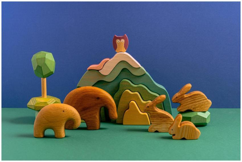 Vibrant collection of wooden animal figurines arra