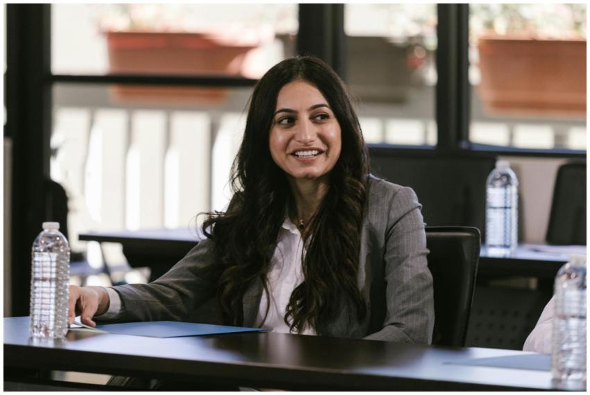 Smiling businesswoman attentively listening during