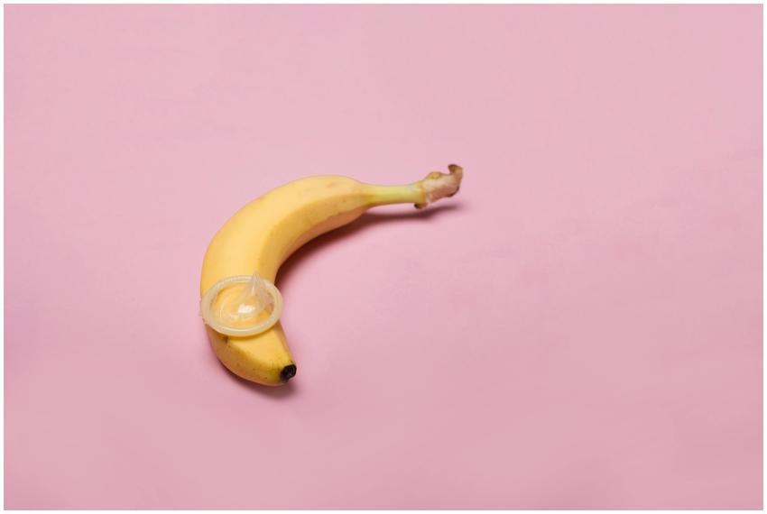 Studio shot of a banana with a condom, symbolizing