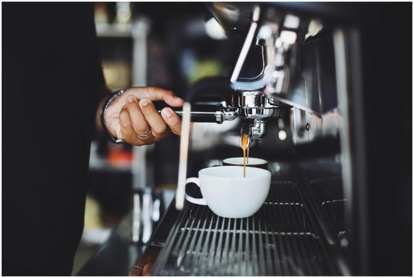 Close-up of a barista preparing espresso in a café