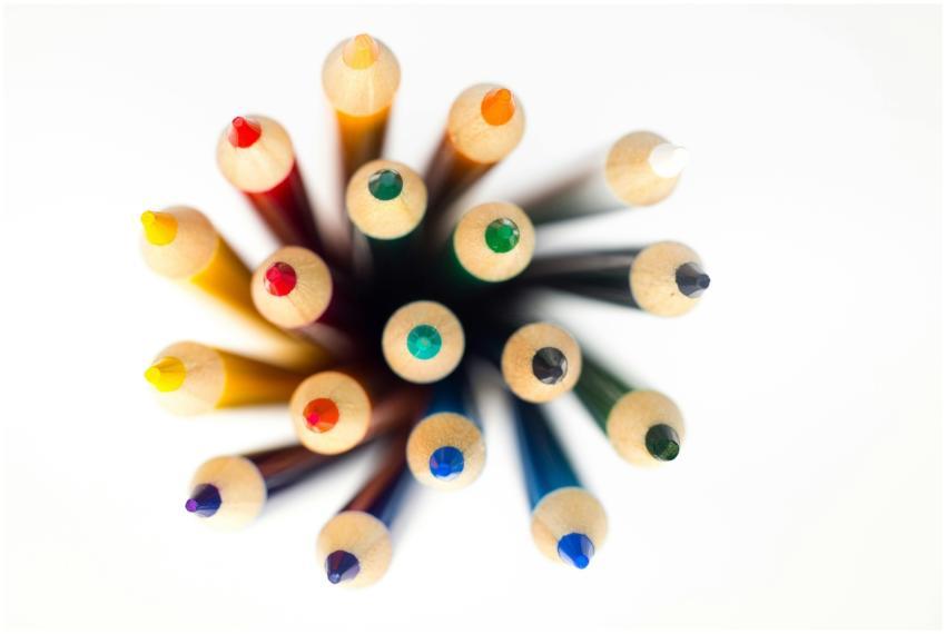 Top view of brightly colored pencils arranged in a