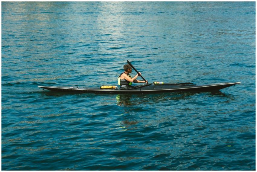 Woman Kayaking Blue Water