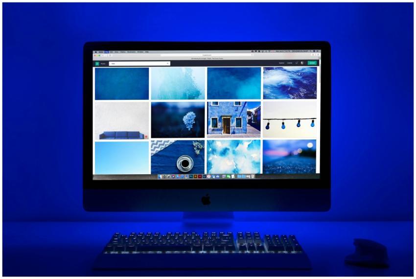 Modern workspace with a glowing blue theme and a c
