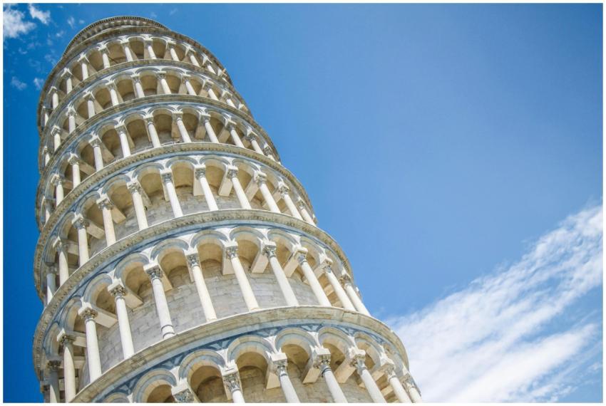 Iconic Leaning Tower of Pisa under a blue sky, a s