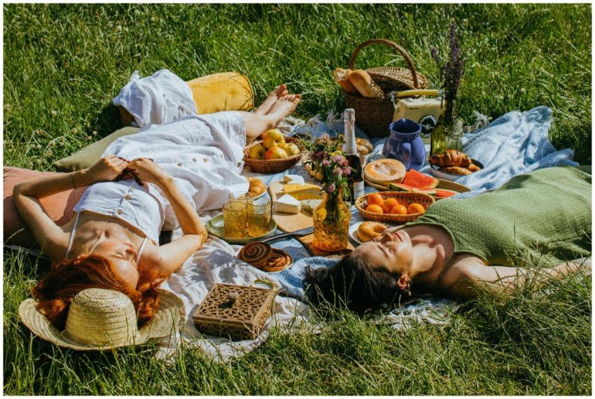 Two women enjoying a peaceful outdoor picnic with
