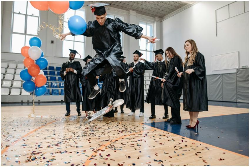 Graduates celebrate indoors with skateboarding and