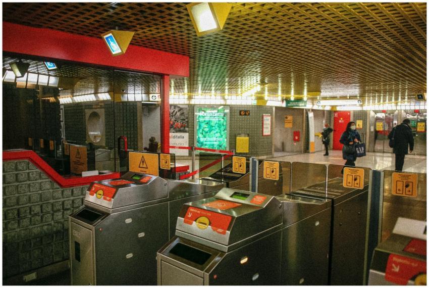 Ticket gates at a busy Milano metro station, showc