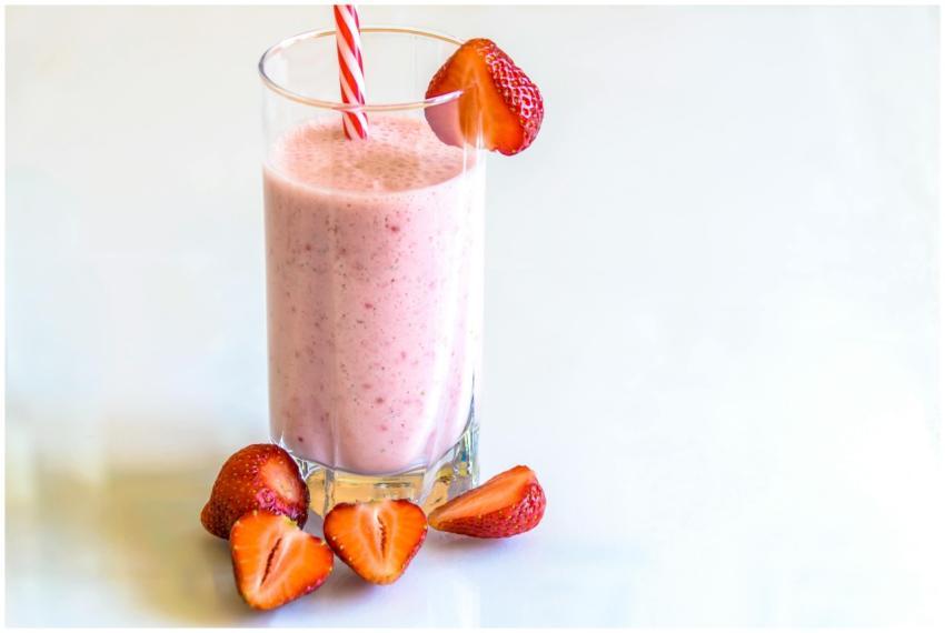 Delicious strawberry smoothie in a glass with fres