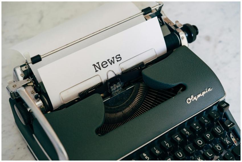 Close-up of an antique typewriter with 'News' on p