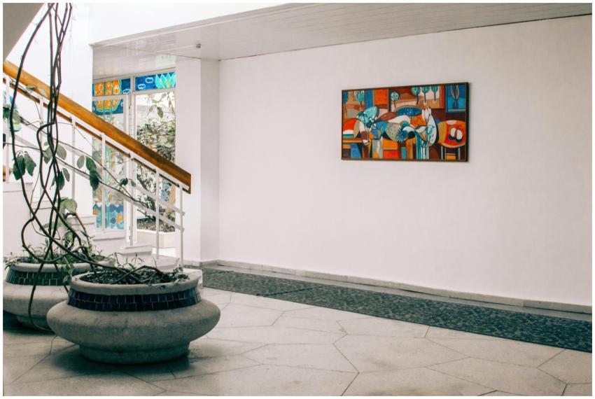 Sleek hall with modern art and planters, showcasin