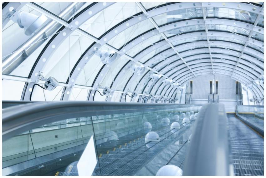 Futuristic glass tunnel interior featuring an esca