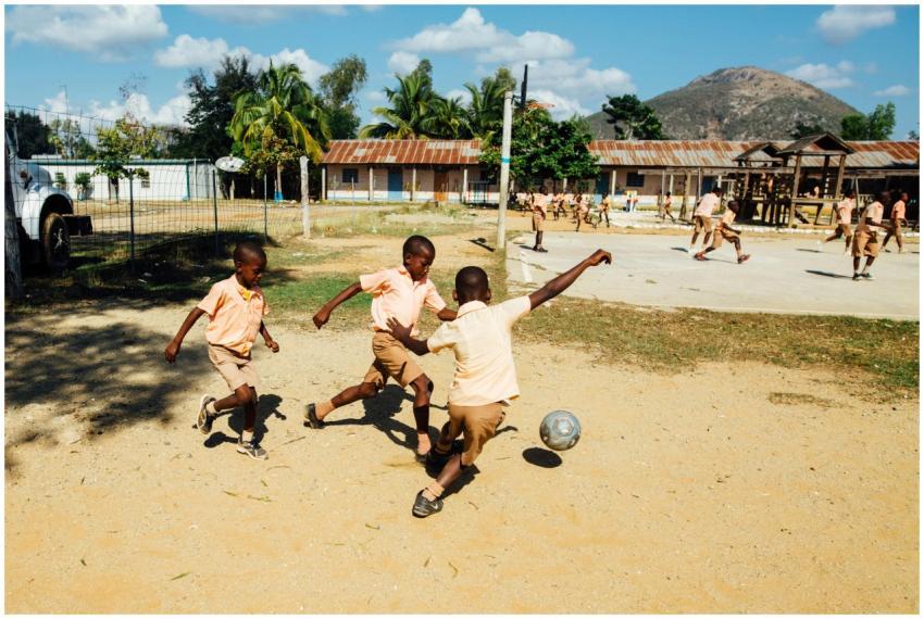 Kids enjoying a soccer game outdoors with energy a