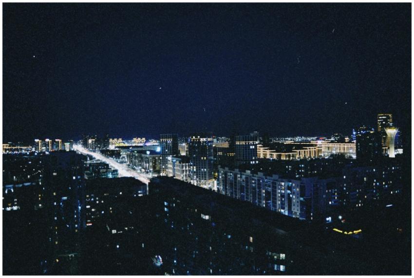 Stunning night aerial shot of Astana's illuminated