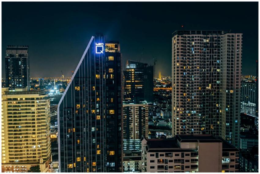 A stunning view of a bustling city skyline at nigh