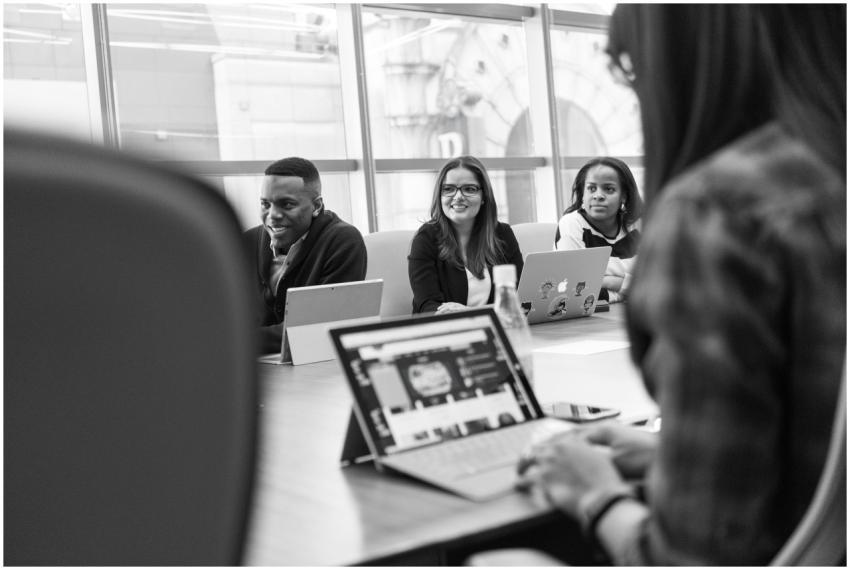 Diverse team of adults engaged in a meeting using